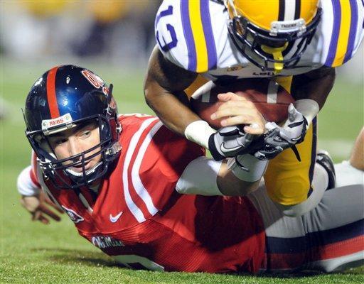 LSU cornerback Ron Brooks (13) sacks and recovers a fumble by Mississippi's Zack Stoudt (8) during an NCAA college football game on Saturday, Nov. 19, 2011, in Oxford, Miss. (AP Photo/Oxford Eagle, Bruce Newman)