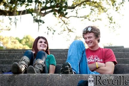 Communication studies junior Jen Coverick, left, and mechanical engineering junior Jared Thomas hang out and enjoy the weather Wednesday in the Greek Amphitheater.