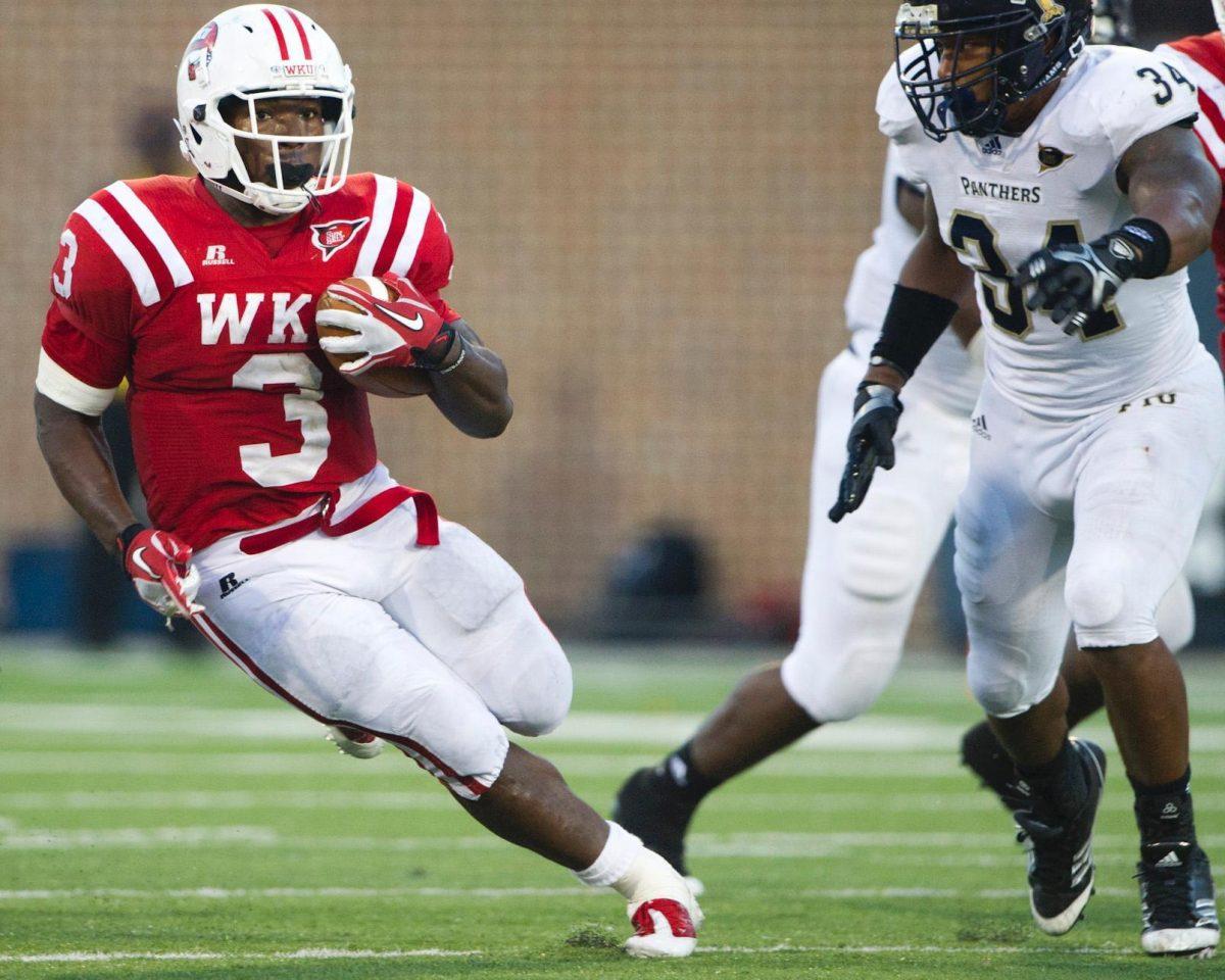 Western Kentucky senior running back Bobby Rainey carries the football in a 10-9 win against Florida International on Nov. 5. He has rushed for 1,169 yards this season.