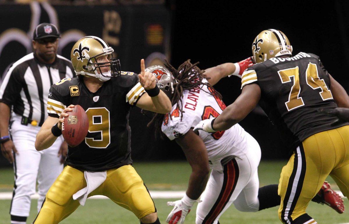 New Orleans Saints quarterback Drew Brees (9) drops back to pass Sunday as offensive tackle Jermon Bushrod (74) blocks against the Tampa Bay Buccaneers.