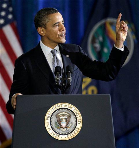 President Obama addresses gestures while speaking at Osawatomie High School in Osawatomie, Kansas, Tuesday, Dec. 6, 2011. Obama was in Kansas to deliver a major speech on the economy.