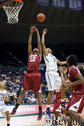 LSU freshman forward Krystal Forthan goes up for a rebound Sunday against Alabama senior forward Ashley Daniels in the PMAC.