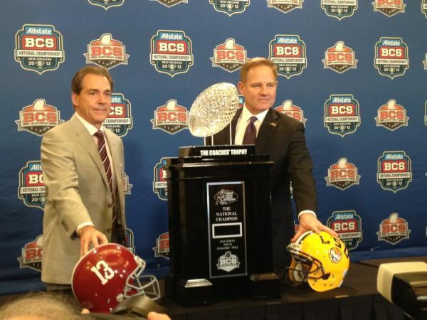 Alabama coach Nick saban and LSU coach Les Miles pose with the BCS National Championship trophy. The two title-winning coaches will rematch for the championship Monday, Jan. 9, in the Mercedes-Benz Superdome.