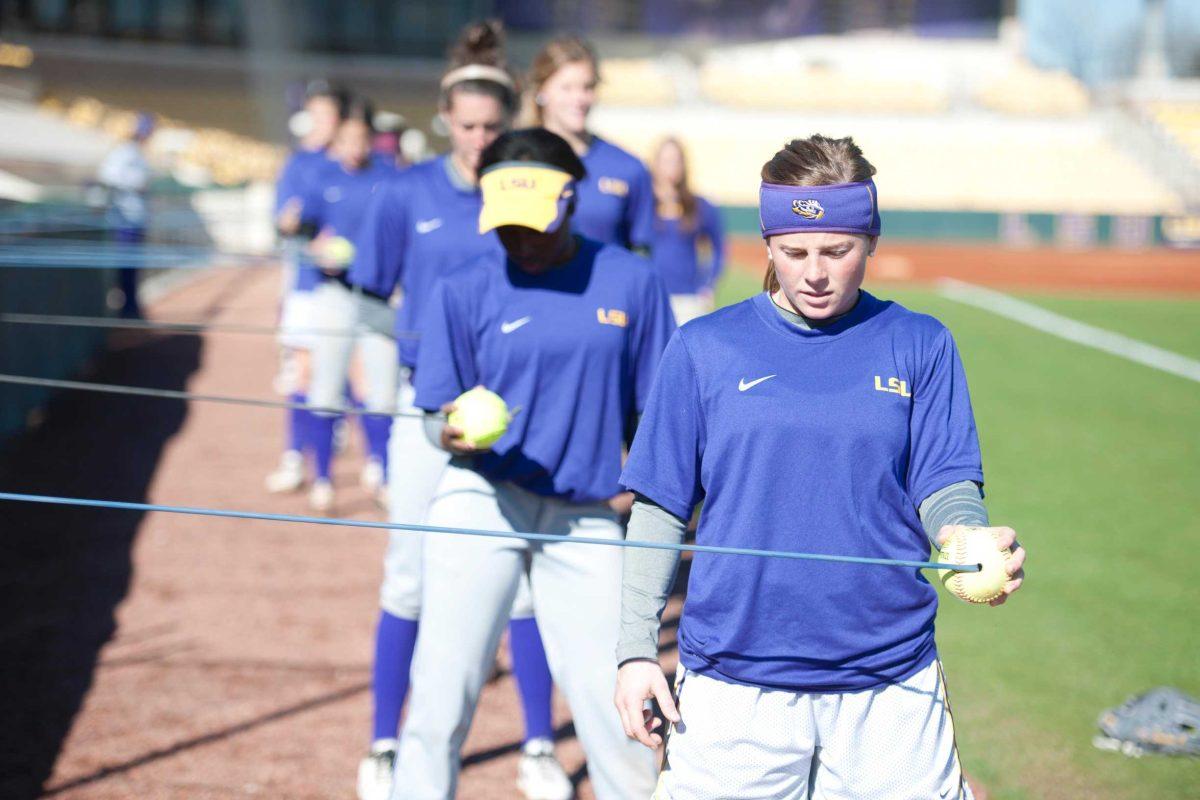 LSU sophomore outfielder Alex Boulet and fellow teammates warmup Jan. 18 at practice in Tiger Park.