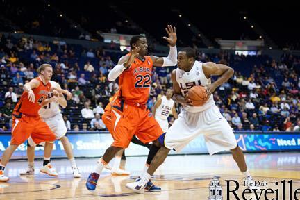 LSU senior forward Storm Warren (24) tries to move past Auburn senior forward Kenny Gabrial (22) on Jan. 17 during LSU&#8217;s 65-58 victory against Auburn in the PMAC.