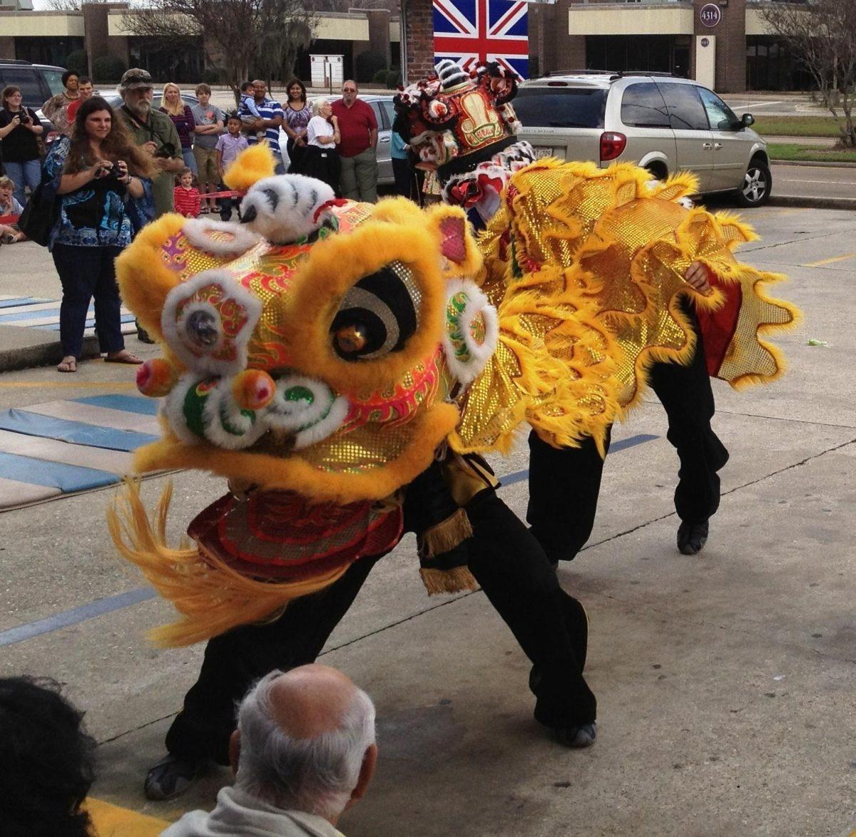 Dancers from the White Crane Kung Fu Studio perform a &#8220;lion dance&#8221; Saturday at the Hunan in celebration of the new year.