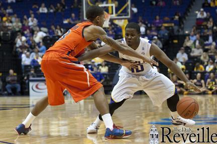 LSU sophomore guard Andre Stringer (10) moves by an Auburn defender Jan. 17 during LSU&#8217;s 65-58 overtime victory against Auburn in the PMAC.