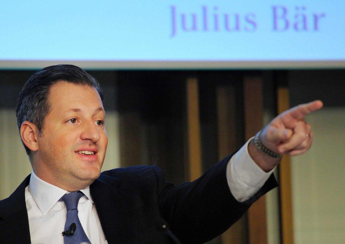 Boris Collardi, CEO of Swiss bank Julius Baer Group, gestures Feb. 6 during a news conference in Zurich, Switzerland. The bank has cautioned investors that the outcome of a U.S. probe into whether it helped American clients cheat on their taxes is uncertain.