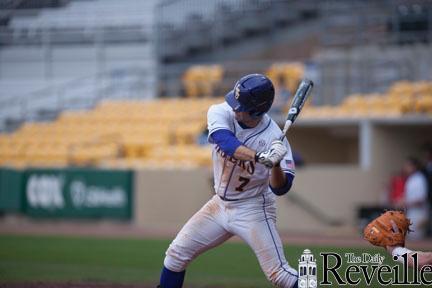 LSU senior utility player Grant Dozar (7) prepares to hit the ball Monday during a scrimmage at Alex Box Stadium.