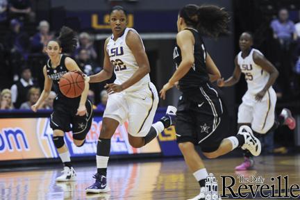 LSU senior forward Courtney Jones (22) dribbles past a Vanderbilt defender Feb. 23 during the Tigers&#8217; 69-66 victory against Vanderbilt in the PMAC.