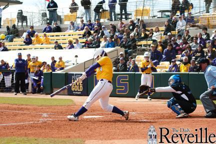 Senior catcher Morgan Russell sends the ball into the field Sunday during the Tigers&#8217; game against Louisiana Tech at Tiger Park. LSU won, 8-0.