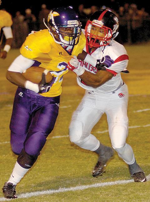 Jeryl Brazil, right, takes down Amite's Jermaine Jolla Jr.