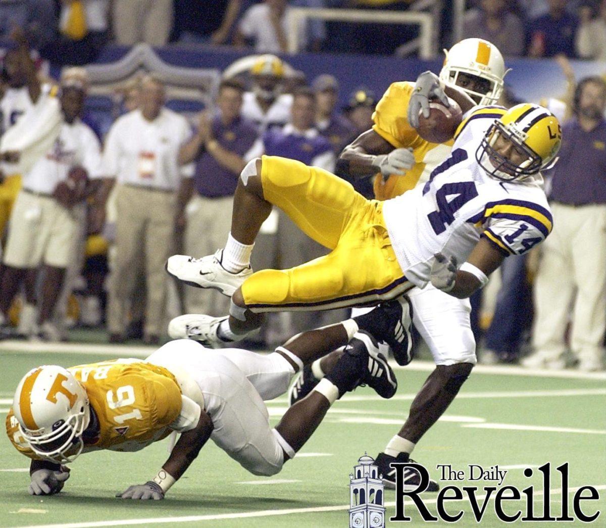 Former LSU wide receiver Michael Clayton is taken down by a defender Dec. 8, 2001, during the SEC Championship vs. Tennessee. The Tigers won, 31-20.