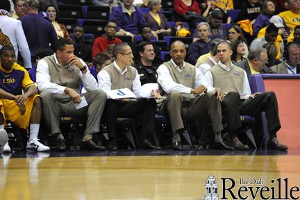 (From left) LSU men's basketball assistant coaches Brent Scott and Donny Guerinoni, head coach Trent Johnson and assistant coach Nick Robinson sport sweater vests Friday in the Tigers' 67-58 win over Alabama.