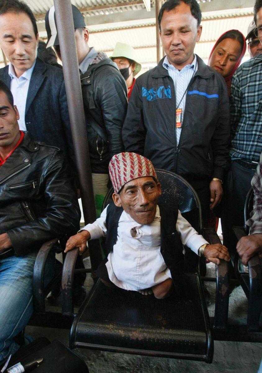 Nepalese Chandra Bahadur Dangi, 72, who says he&#8217;s only 22 inches (56 centimeters) tall, sits on a chair Wednesday in Katmandu, Nepal.