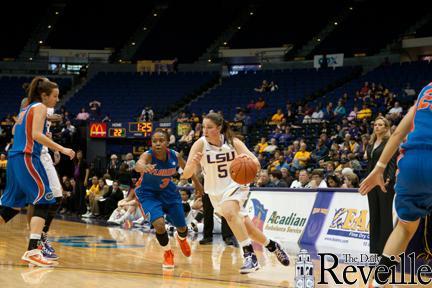 Sophomore guard Jeanne Kenney (5) drives past a Florida defender Thursday during the Tigers&#8217; 73-64 loss to the Gators in the PMAC.