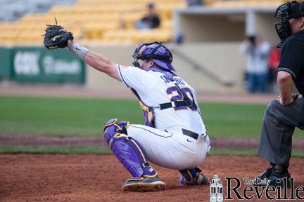 Senior catcher Jordy Snikeris (20) hauls in a pitch Jan. 30 during a scrimmage at Alex Box Stadium.