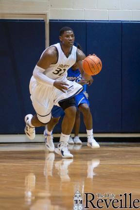 Brian Bridgewater, Episcopal Knights junior forward, dribbles Jan. 31 at a game against Northeast High School. Bridgewater is considering attending LSU, Arizona or Oklahoma.