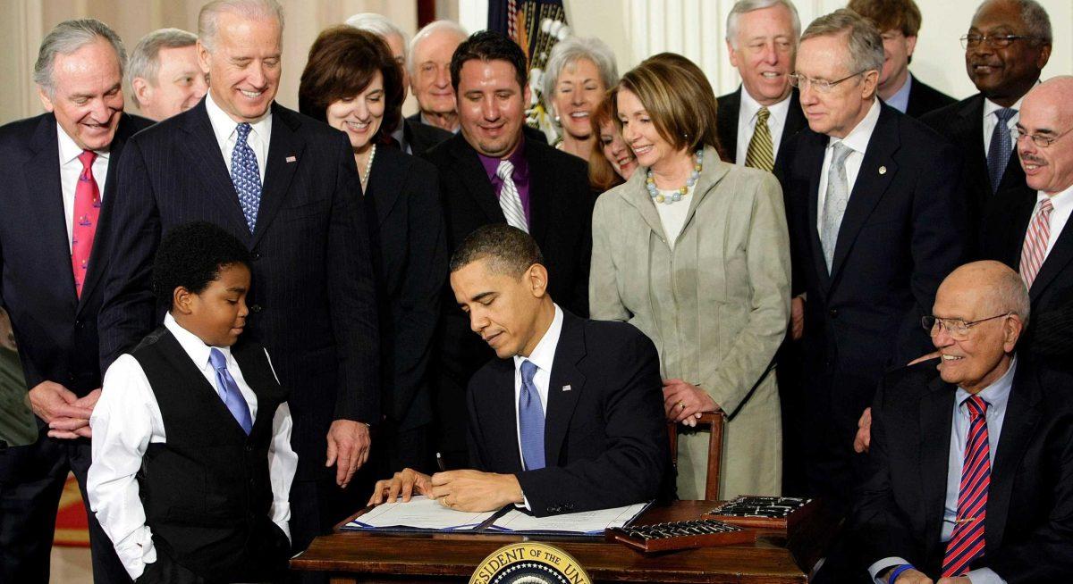 President Barack Obama signs the Affordable Care Act on March 23, 2010, in the East Room of the White House in Washington. Supreme Court deliberations over the law will start Monday.