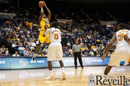 LSU senior forward Storm Warren (24) shoots over a Tennessee defender Wednesday during the Tigers&#8217; 74-69 overtime loss to Tennessee in the PMAC.