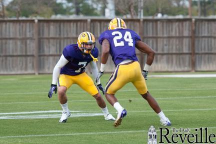 LSU cornerback Tyrann Mathieu, left, guards a teammate in a drill at football practice Tuesday. The practice also saw Mo Isom&#8217;s tryout for a walk-on kicker position.