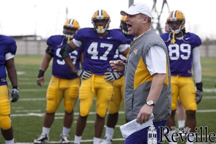 LSU football coach Les Miles calls out names for the &#8220;Big Cat&#8221; drill Thursday at the Tigers&#8217; spring practice. Linebacker Ronnie Feist pinned running back Kenny Hilliard during the drill.