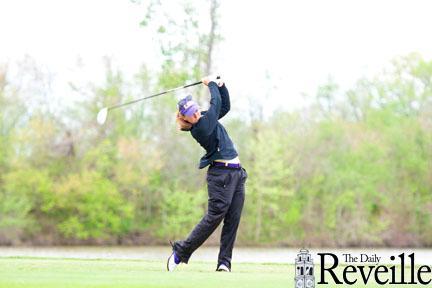 LSU sophomore golfer Austin Ernst tees off on a hole Saturday during the LSU Tiger Golf Classic at the University Club golf course.