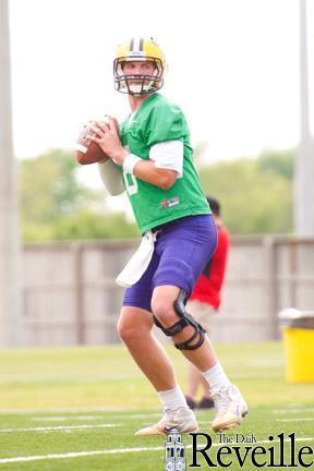 LSU junior quarterback Zach Mettenberger prepares to throw the ball Thursday during practice.