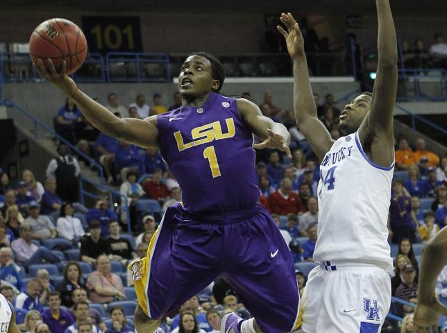 LSU guard Anthony Hickey (1) scores past the defense of Kentucky forward Michael Kidd-Gilchrist (14) during the first half of an NCAA college basketball game in the second round of the 2012 Southeastern Conference tournament at the New Orleans Arena in New Orleans, Friday, March 9, 2012.