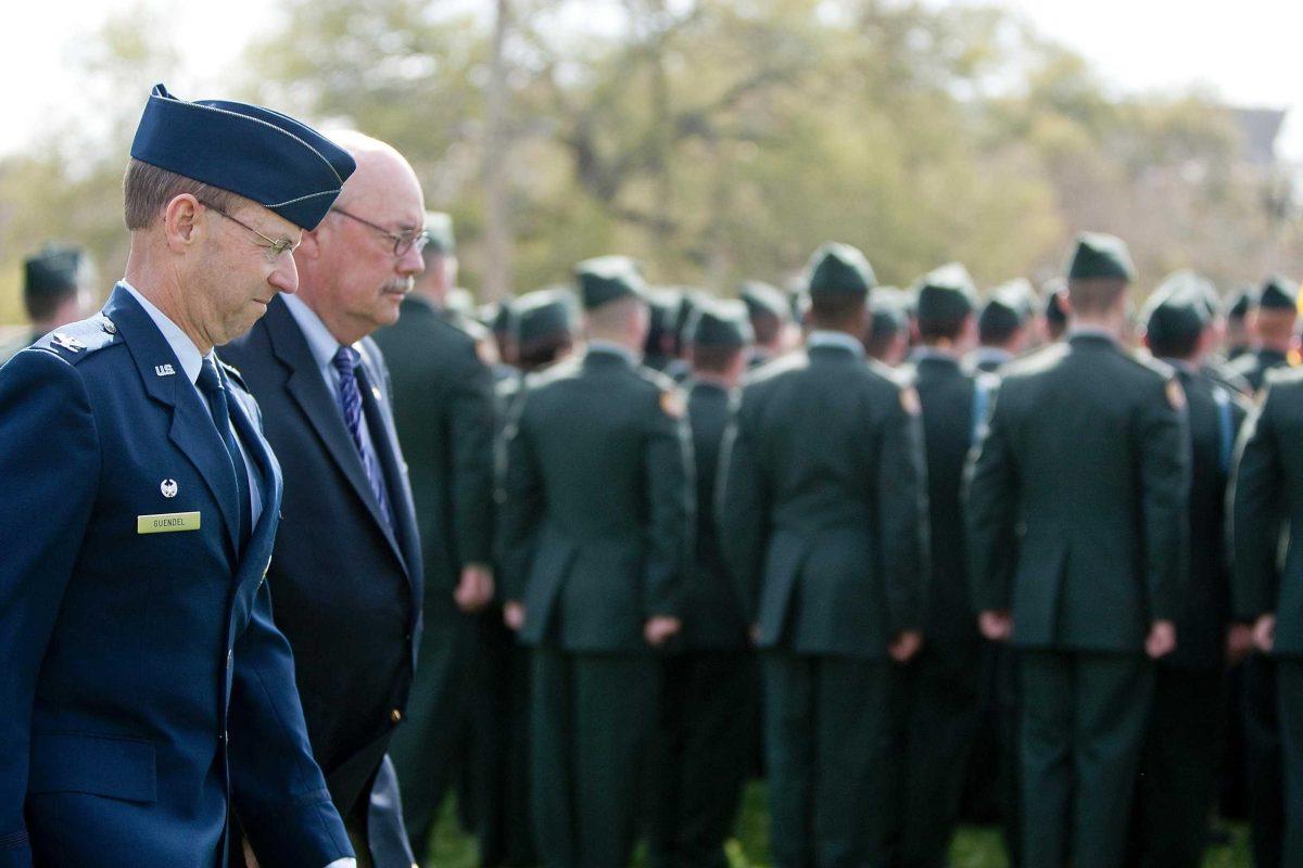 Col. Fred Guendel, LSU&#8217;s commandant of cadets, left, and University Chancellor Michael Martin walk behind the LSU Army ROTC for inspection during the Chancellor&#8217;s Day Parade on March 18, 2010, on the Parade Ground.