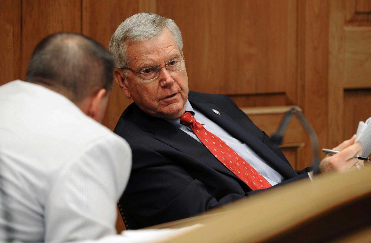 Reps. Alan Seabaugh, R-Shreveport, left, and Frank Hoffmann, R-West Monroe, confer Thursday during debate of a bill that would create a new retirement plan for new state employees.