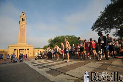 Runners line up Saturday at the start of the 5K hosted by Tigers Against Trafficking.