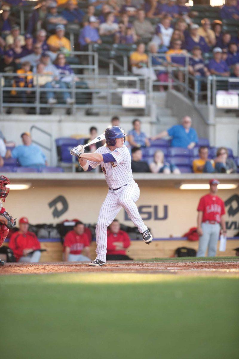 LSU junior left fielder Raph Rhymes prepares to swing at a pitch Wednesday during the Tigers&#8217; 5-4 victory against Lamar University at Alex Box Stadium.