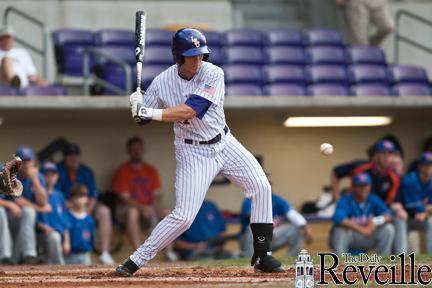 LSU freshman infielder Jared Foster eyes a pitch Tuesday during the Tigers&#8217; 10-2 victory against Louisiana College at Alex Box Stadium.