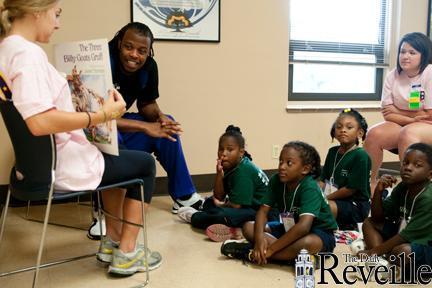 LSU senior defensive end Lavar Edwards reads &#8220;The Three Billy Goats Gruff&#8221; to children in Peabody Hall on Tuesday.