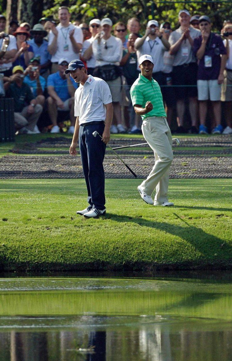 Sean O&#8217;Hair (left) laughs as Tiger Woods (right) reacts Wednesday after skipping his ball on the 16th hole during practice for the Masters in Augusta, Ga.