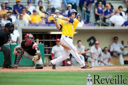 LSU freshman infielder Tyler Moore drives a ball into the outfield Sunday during the Tigers&#8217; 5-3 loss aganst Georgia in Alex Box Stadium.