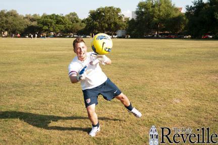 Kinesiology junior Craig Verdin dives in front of the ball Tuesday on the Parade Ground.