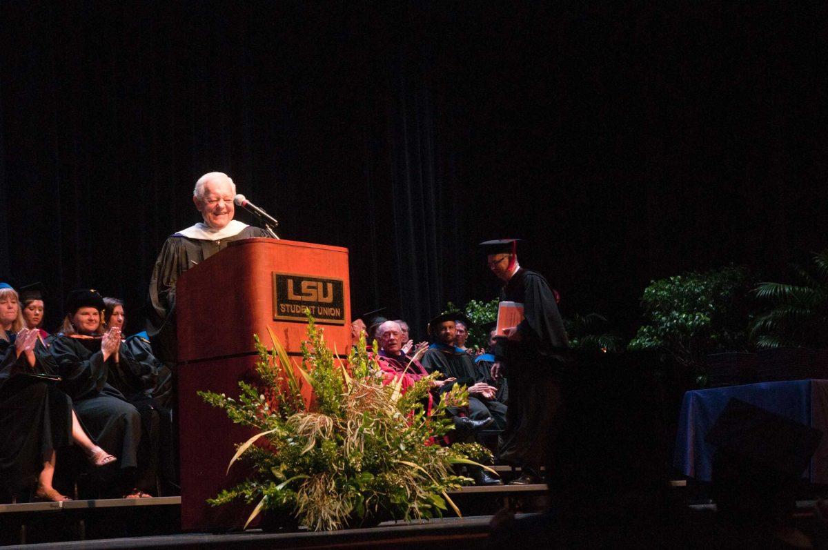 Manship Dean Jerry Ceppos awarded journalist Bob Schieffer a crystal plaque to thank him for being Friday's commencement speaker.