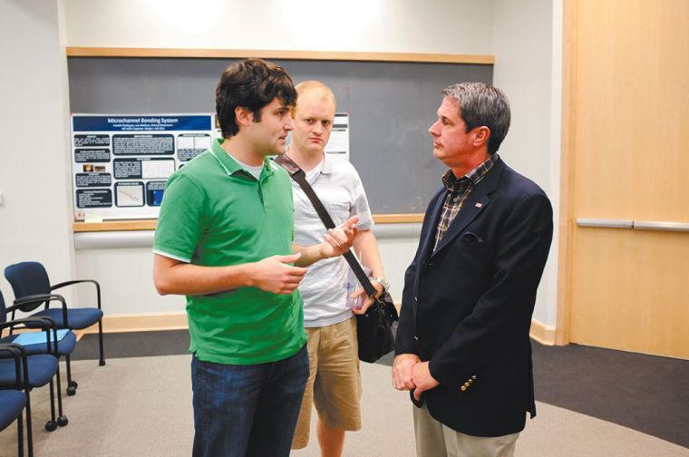 Chris Brown (left) and Lance Brumfield (center), mechanical engineering graduate students speak with Senator David Vitter after he spoke in fornt of engineering students and professors Monday afternoon in the Frank H. Walk Room as part of the Dean's Distinguished Lecture Series hosted by the College of Engineering.