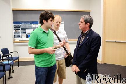 Mechanical engineering graduate students Chris Brown (left) and Lance Brumfield (center) speak with Sen. David Vitter on Monday after his Distinguished Lecture Series speech hosted by LSU&#8217;s College of Engineering in the Frank H. Walk Room.