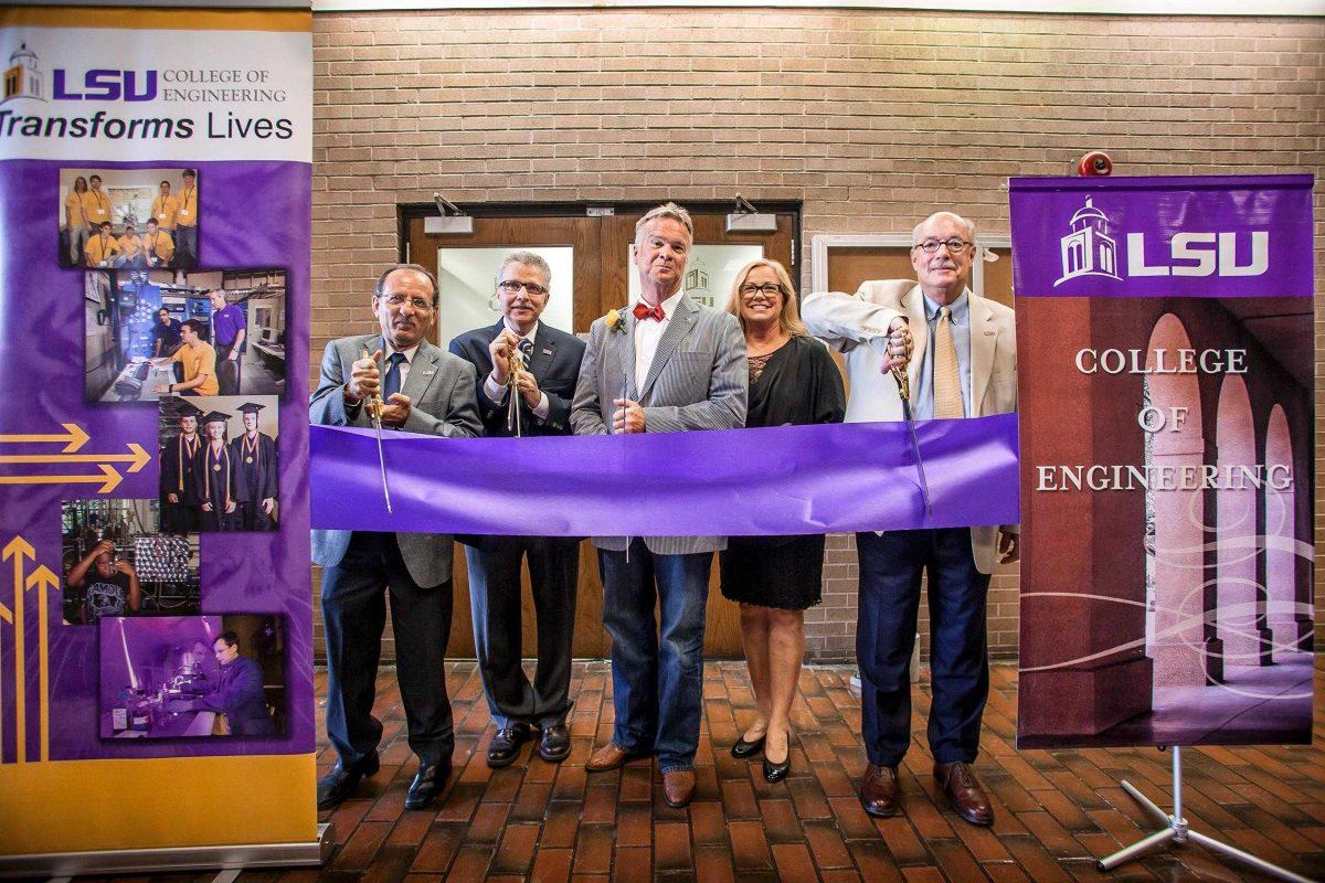 Engineering professors Louay Mohammad and George Voyladjis, Diamond B Construction president Bryan Bossier, Renee Bossier and LSU Chancellor Michael Martin prepare to cut the ribbon at the ribbon cutting ceremony of the new L.H. Bossier Laboratory on May 16.