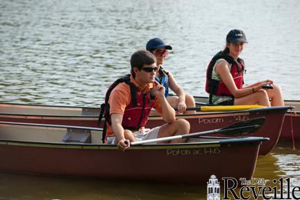 Students listen intently to paddling instruction during the UREC&#8217;s Canoeing 101 class Wednesday afternoon on the LSU Lakes.