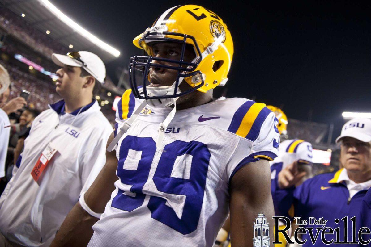 LSU sophomore defensive end Sam Montgomery (99) heads back to the locker room before the Tigers' 9-6 overtime victory against Alabama Saturday, Nov. 5, 2011, at Bryant-Denny Stadium in Tuscaloosa, Ala.