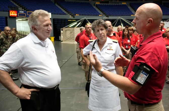 Mark Spradlin (Right) explains the situation to Assistant Secretary for Prepardness and Response for the U.S. Department of Health and Human Services Dr. Nicole Lavie (Middle) and Louisiana Department of Health and Hospitals State Health Officer Dr. Jim Guidrey on Friday during their visit to the PMAC. Friday, Aug. 31, 2012.