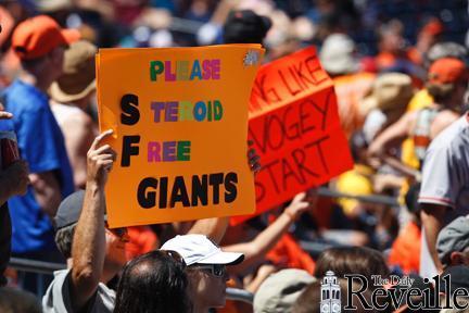 A San Francisco Giants&#8217; fan holds up a sign during a baseball game against the San Diego Padres on Sunday in San Diego.