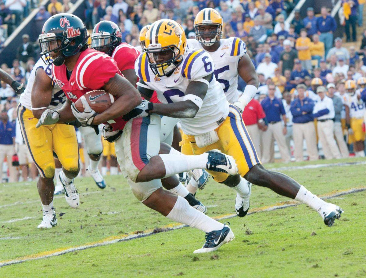 LSU senior safety Craig Loston stops a run by an Ole Miss player Nov. 20, 2010, during the Tigers&#8217; 43-36 win against the Rebels in Tiger Stadium.