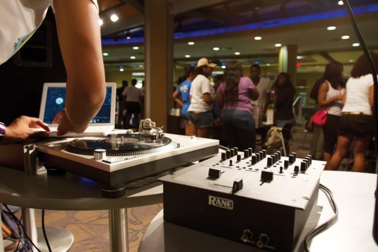 DJ Midas Touch spins records Friday during the Umoja Unity Celebration in the LSU Student Union.
 