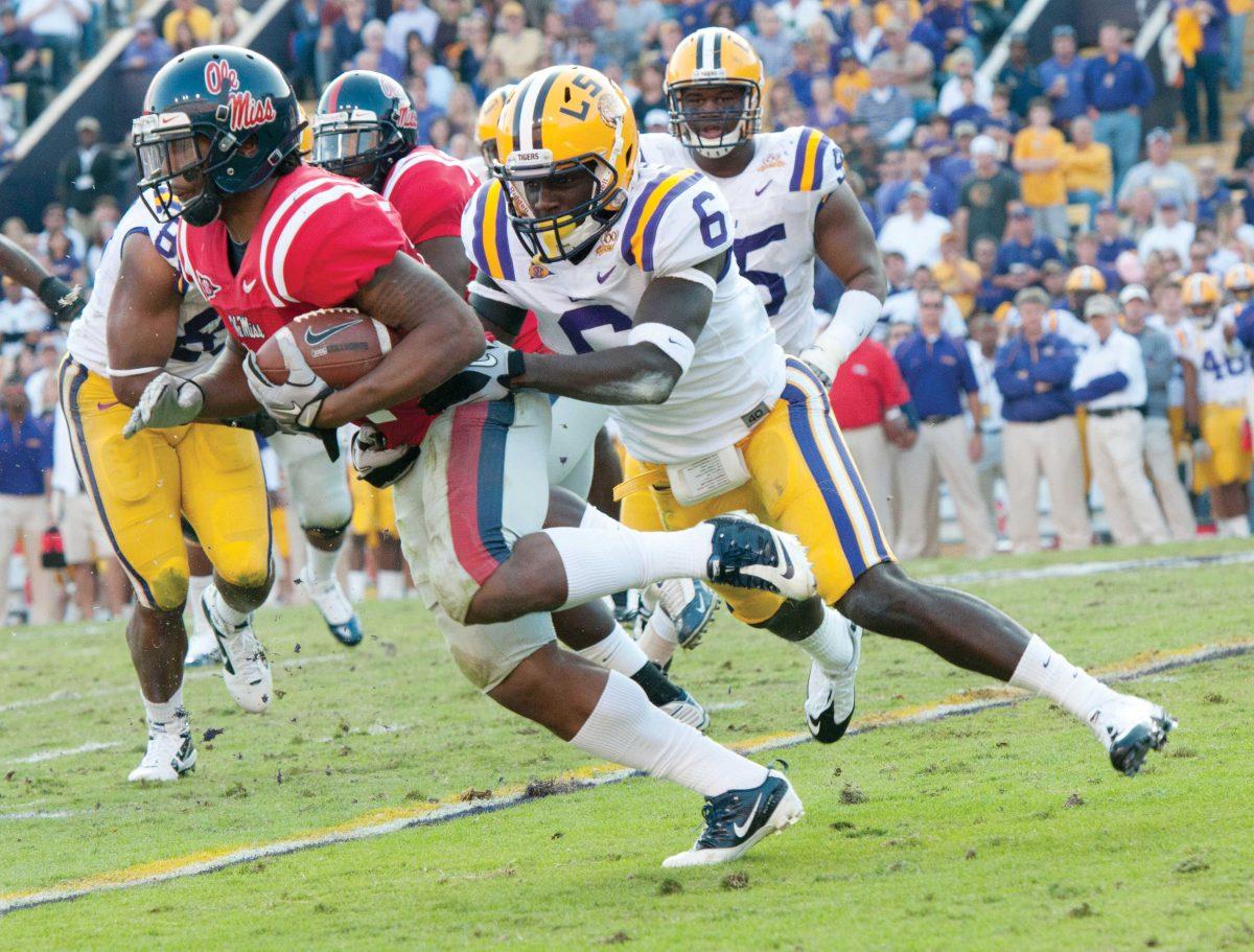 <p>Safety Craig Loston stops a run by an Ole Miss player during the Tigers' last home game of the season. LSU beat Ole Miss 43-36 Saturday, November 20, 2011 in Tiger Stadium.</p>