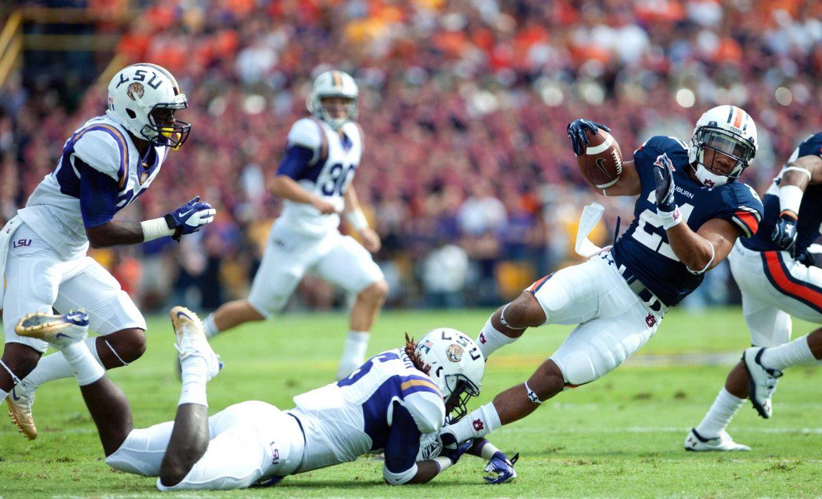 LSU junior safety Craig Loston (6) takes down an Auburn player Oct. 22, 2011, during the Tigers&#8217; 45-10 victory in Tiger Stadium.